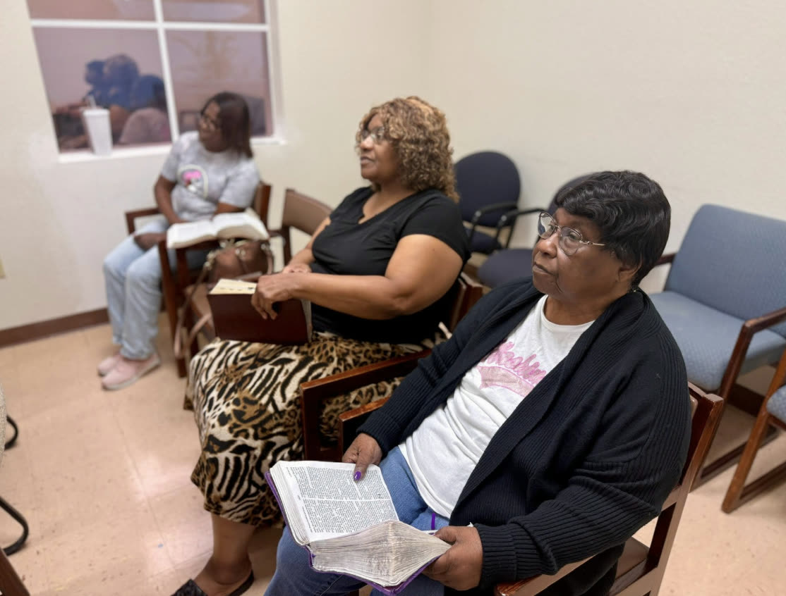 Members studying the Bible together
