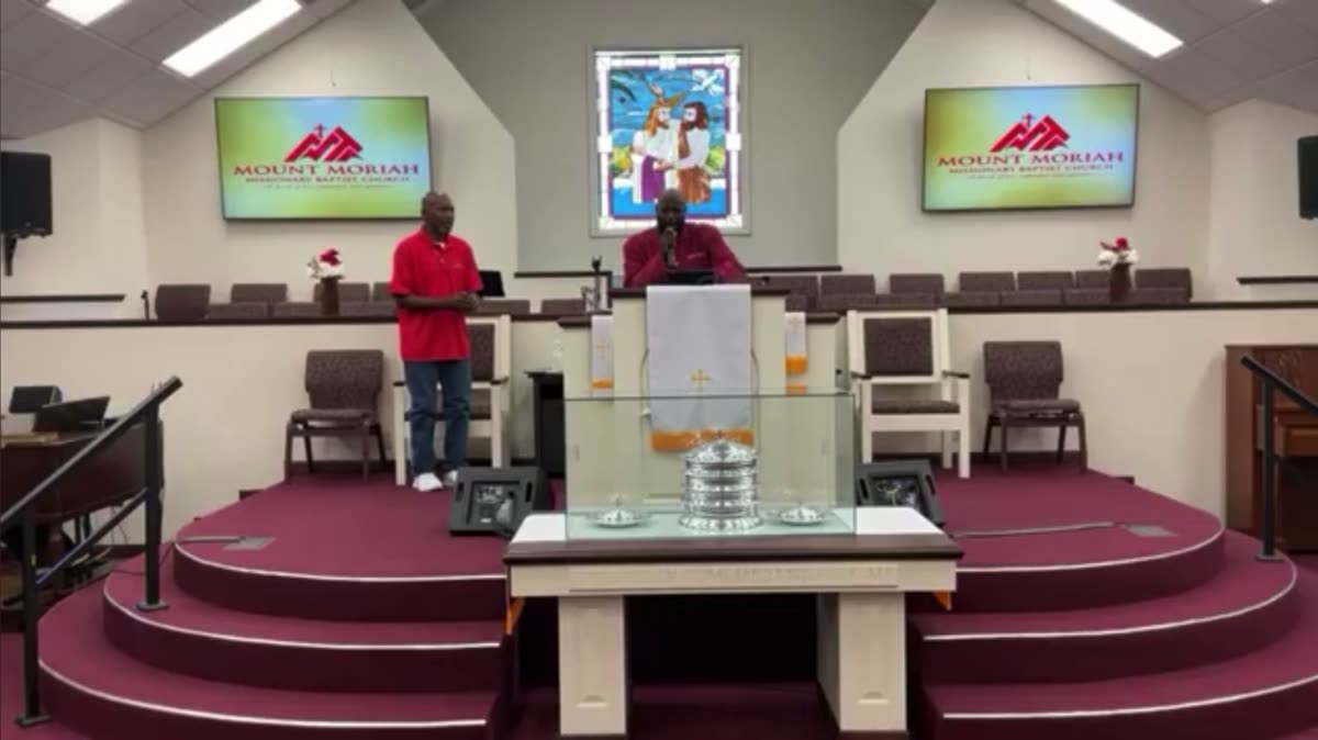 The church family standing together in worship